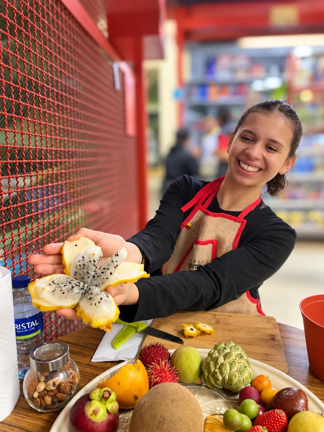 321 Colombia guide presenting yellow pitahaya during the seated tasting